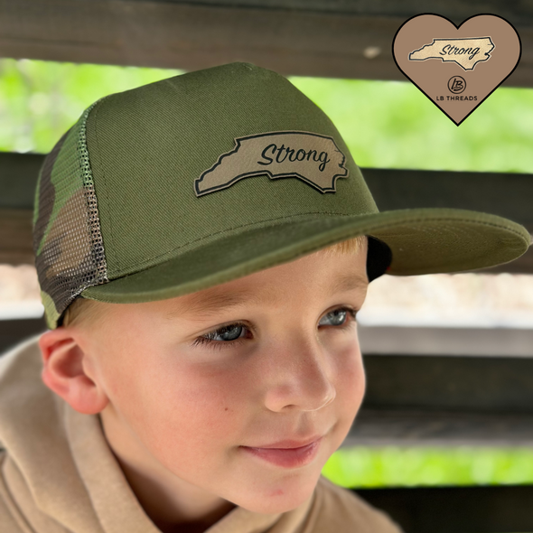 Green Camo Carolina Strong Snapback Hat | Olive green trucker hat with a green and brown camo mesh back. Support Hurricane Helene relief efforts with a Carolina Strong patch! | LB Threads