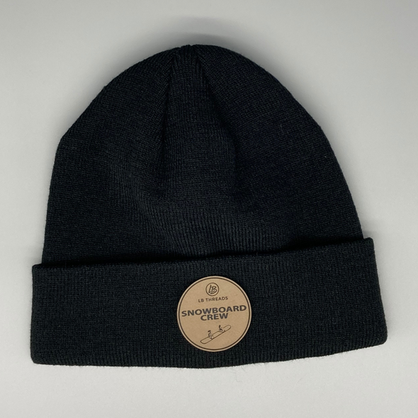 Shop online for beanies and snapback hats from LB Threads for babies, toddlers, kids and adults. Photo shows our Snowboard Crew Beanie, a warm, soft, black, tan or cream acrylic beanie with a colored leather Snowboard Crew patch.