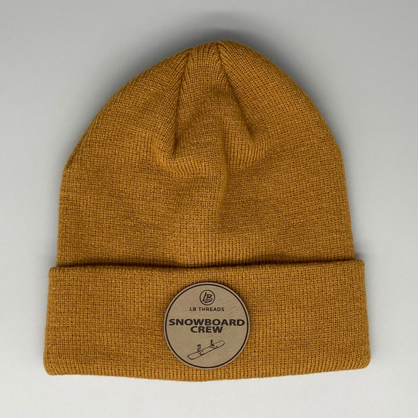 Shop online for beanies and snapback hats from LB Threads for babies, toddlers, kids and adults. Photo shows our Snowboard Crew Beanie, a warm, soft, black, tan or cream acrylic beanie with a colored leather Snowboard Crew patch.