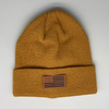 Shop online for beanies and snapback hats from LB Threads for babies, toddlers, kids and adults. Photo shows our Flag & State Beanie, a warm, soft, black, tan or cream acrylic beanie with a colored leather American flag patch.