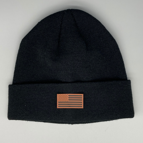 Shop online for beanies and snapback hats from LB Threads for babies, toddlers, kids and adults. Photo shows our Flag & State Beanie, a warm, soft, black, tan or cream acrylic beanie with a colored leather American flag patch.