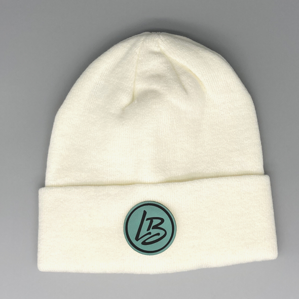 Shop online for beanies and snapback hats from LB Threads for babies, toddlers, kids and adults. Photo shows our Classic LB Beanie, a warm, soft, black, tan or cream acrylic beanie with a colored leather LB logo patch.