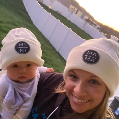 Shop online for beanies and snapback hats from LB Threads for babies, toddlers, kids and adults. Mom model in our Mama Beanie, a warm, soft, black, tan or cream acrylic beanie with a colored leather Mama patch, holding her infant daughter in our matching Mini beanie.